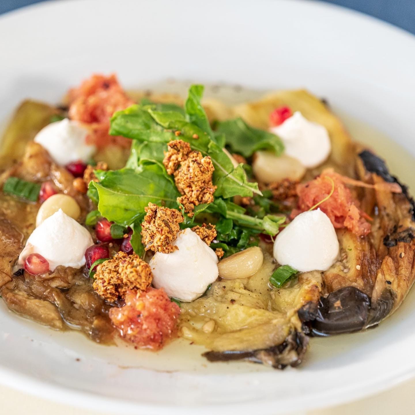 Roasted eggplant with burrata and pomegranate